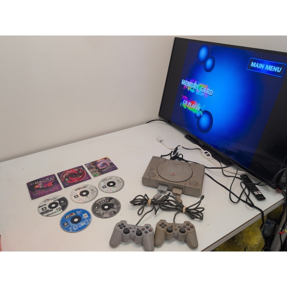 Sony PlayStation 1 Gray  System Tested Working Plus 2 Controllers 8 Games Cords